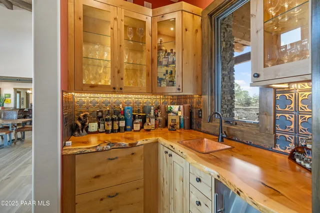 a bathroom with a granite countertop toilet sink and mirror