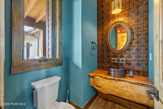 a bathroom with a glass shower door