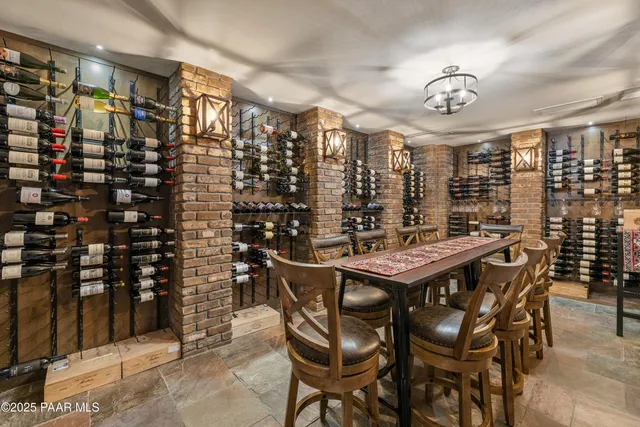 a view of walk in closet with clothes