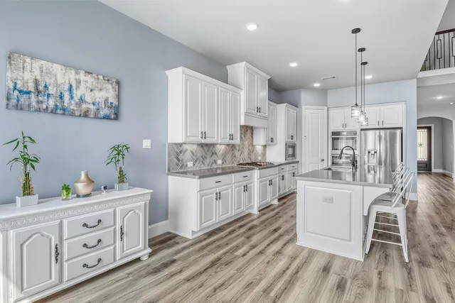 a view of living room kitchen and entryway
