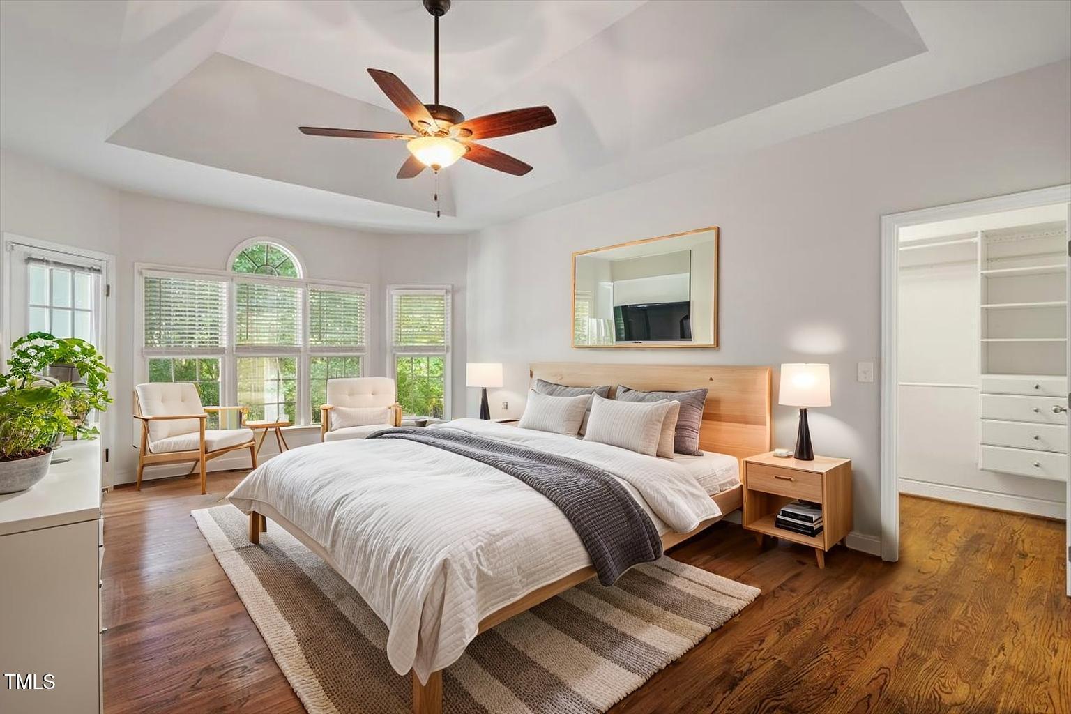 1913 Katesbridge Lane Raleigh, NC 27614 - Photo 14 of 38 a bedroom with a large bed and a chandelier