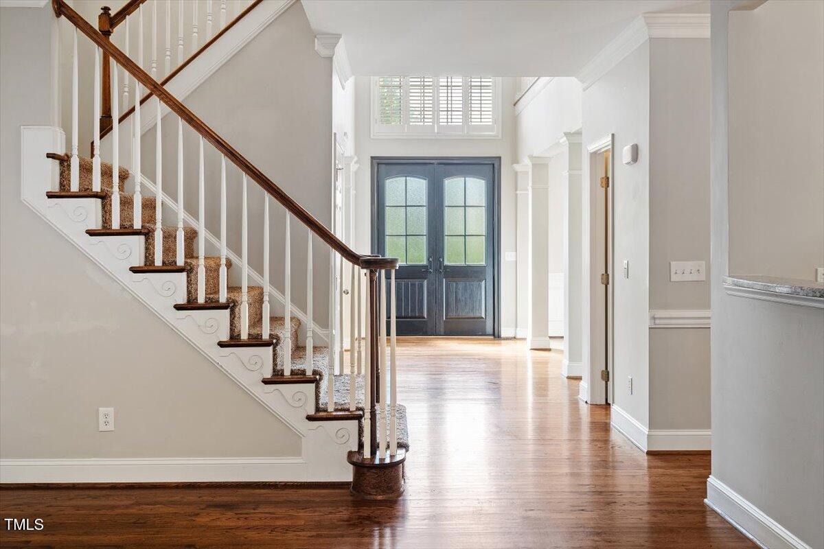 1913 Katesbridge Lane Raleigh, NC 27614 - Photo 19 of 38 a view of staircase with white walls and windows