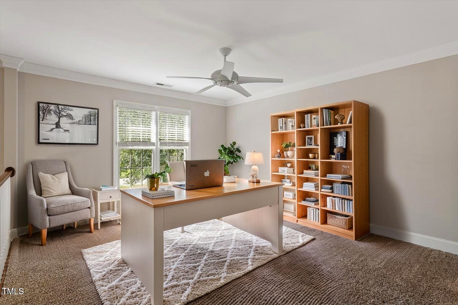 1913 Katesbridge Lane Raleigh, NC 27614 - Photo 21 of 38 a living room with furniture and a book shelf