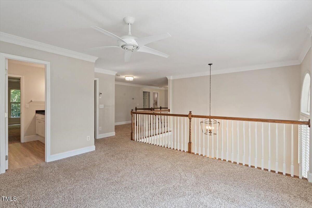 1913 Katesbridge Lane Raleigh, NC 27614 - Photo 22 of 38 a view of a hallway with staircase