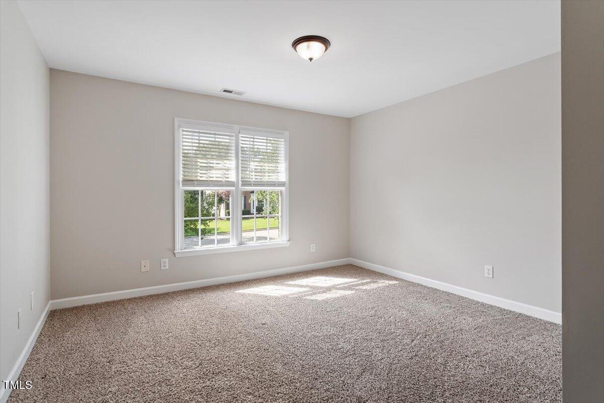 1913 Katesbridge Lane Raleigh, NC 27614 - Photo 25 of 38 an empty room with a window