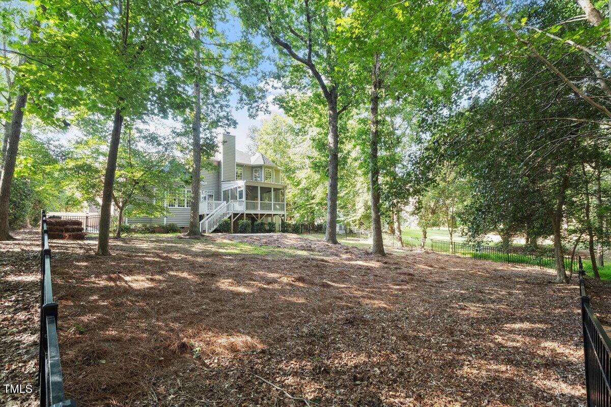 1913 Katesbridge Lane Raleigh, NC 27614 - Photo 31 of 38 a view of a tree in front of a house