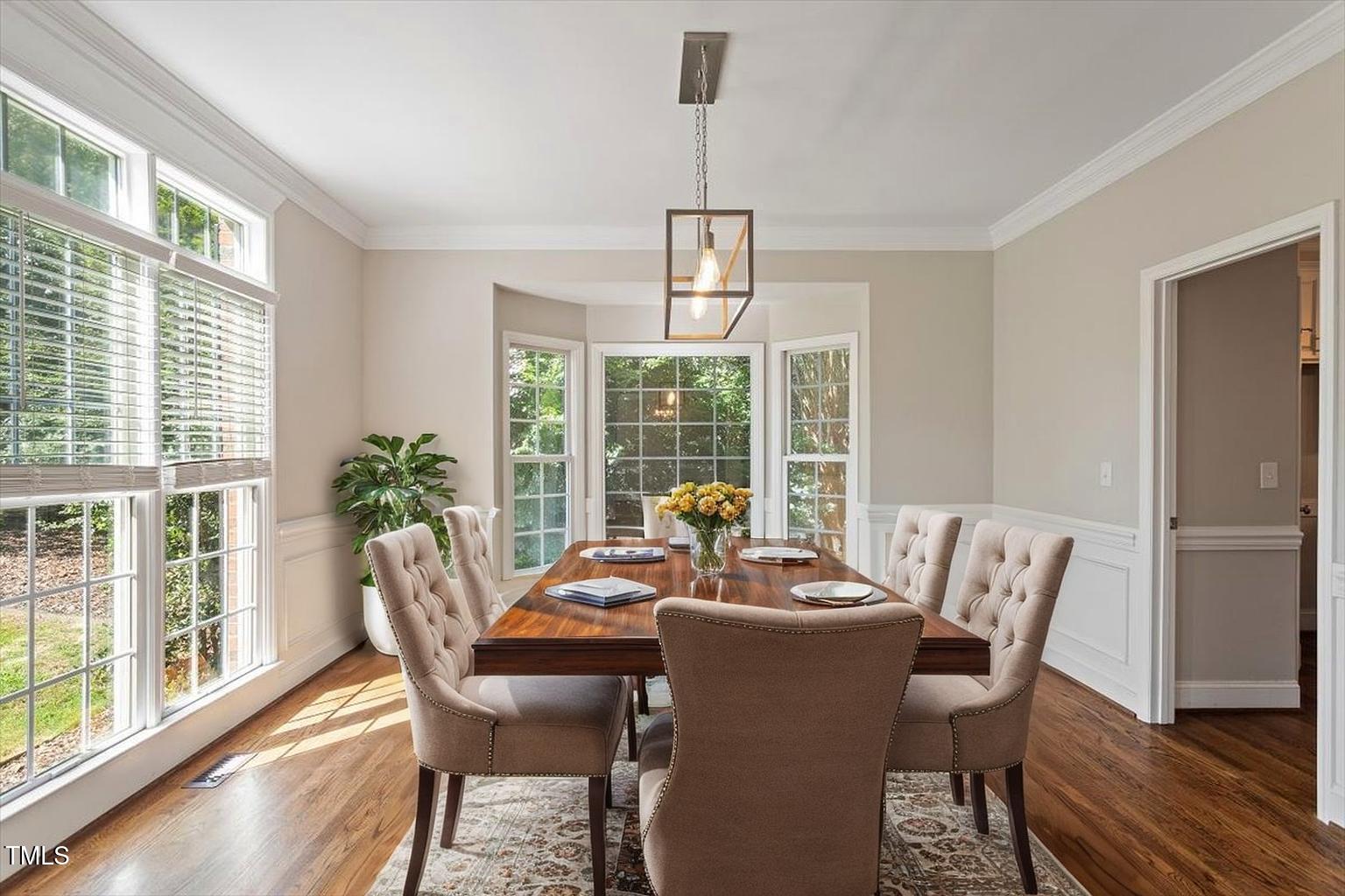 1913 Katesbridge Lane Raleigh, NC 27614 - Photo 4 of 38 a view of a dining room with furniture window and wooden floor