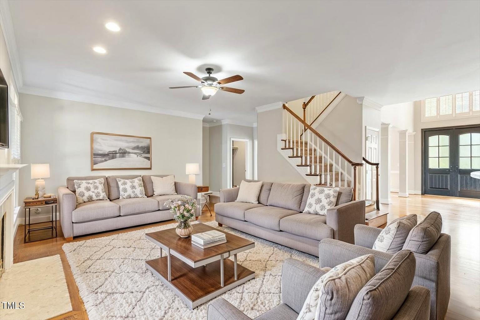 1913 Katesbridge Lane Raleigh, NC 27614 - Photo 8 of 38 a living room with furniture a rug and a chandelier