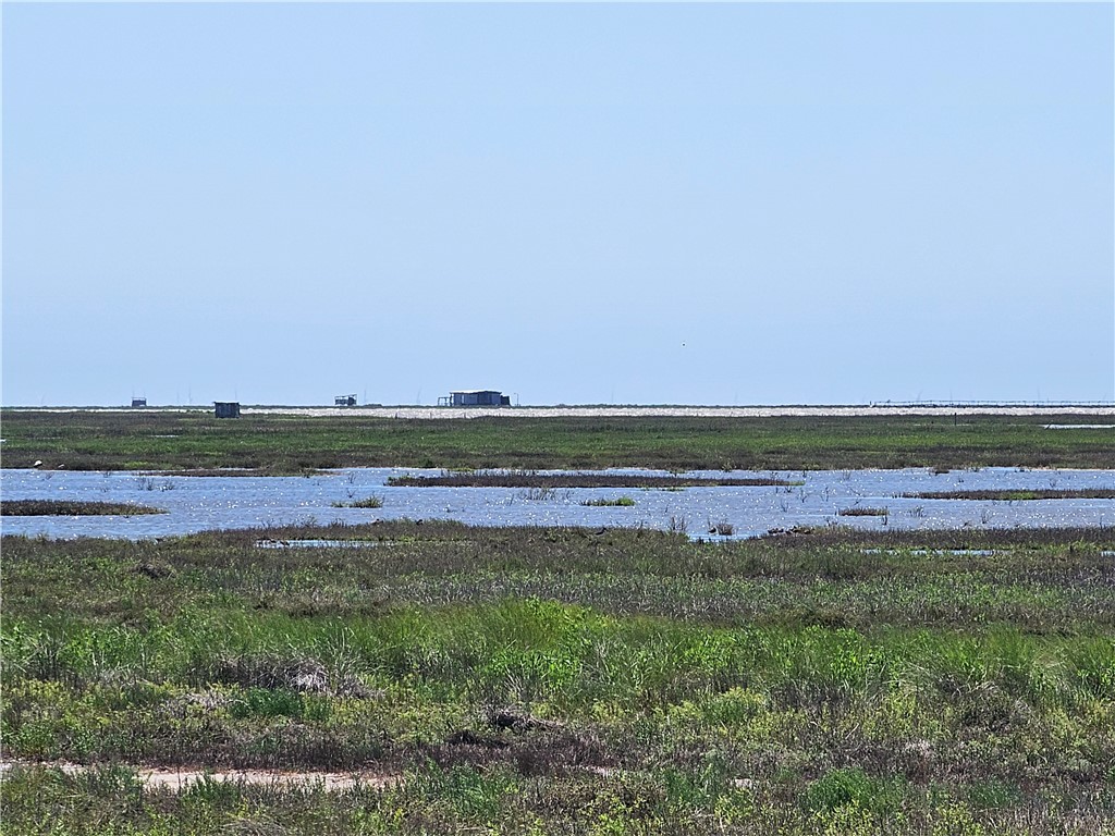 227 Palmetto Point Road Rockport, TX 78382 - Photo 8 of 10 a view of a field with an ocean