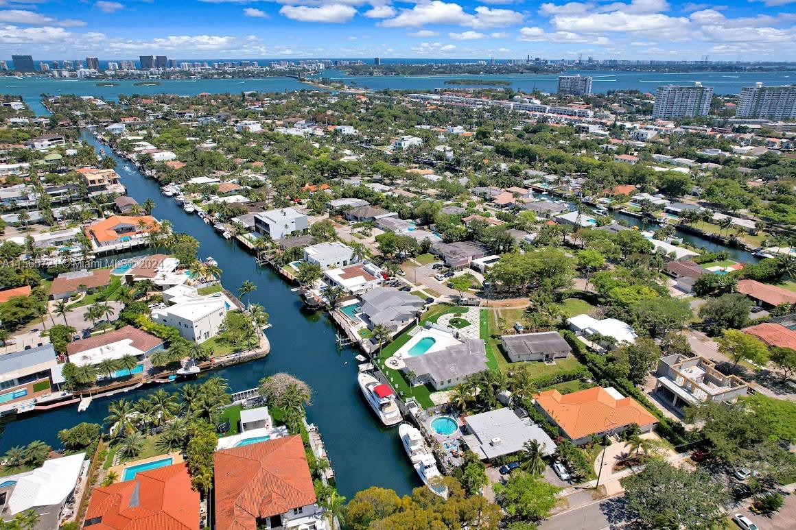 12735 Ixora Road Miami, FL 33181 - Photo 1 of 16 an aerial view of residential houses with outdoor space