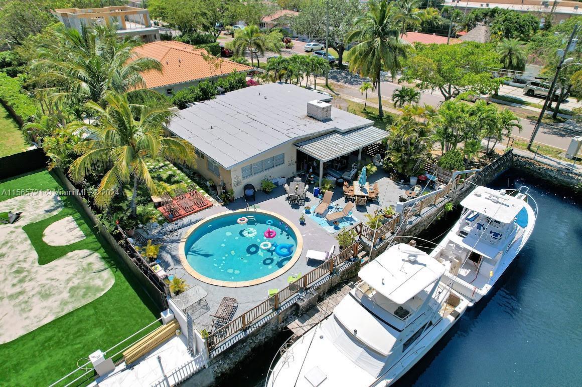 12735 Ixora Road Miami, FL 33181 - Photo 14 of 16 an aerial view of a house with garden space and trees
