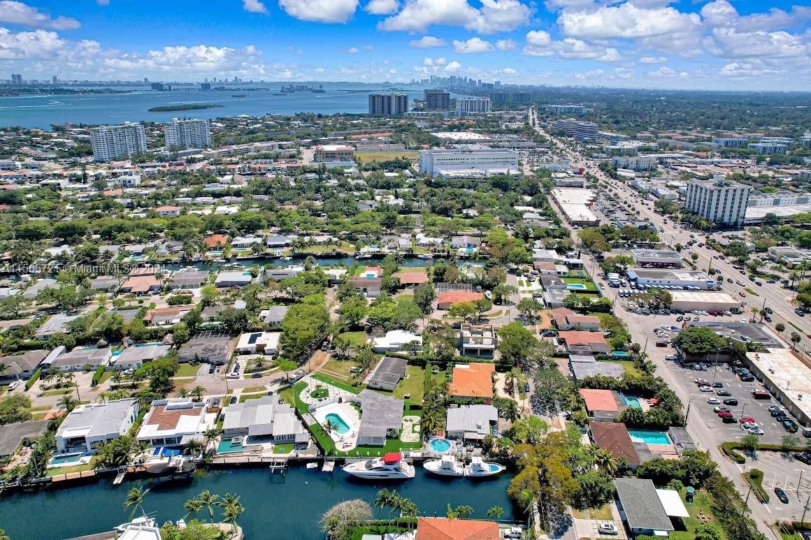 12735 Ixora Road Miami, FL 33181 - Photo 16 of 16 an aerial view of a city with lots of residential buildings ocean and mountain view in back