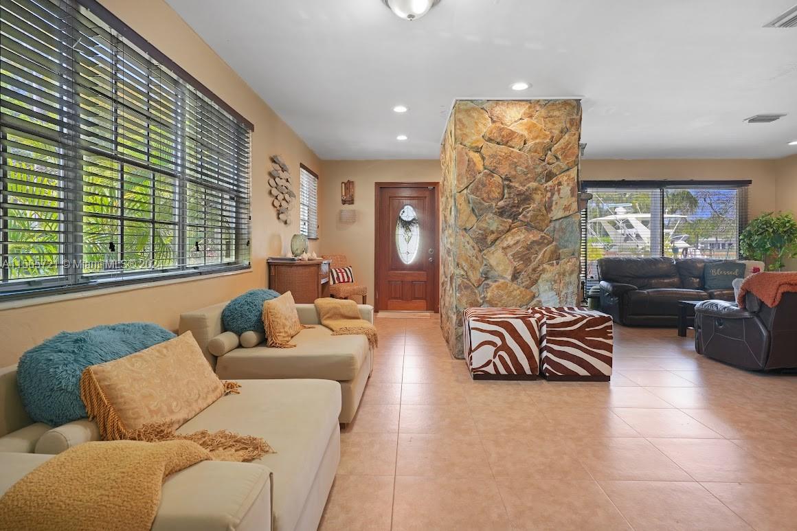 12735 Ixora Road Miami, FL 33181 - Photo 10 of 16 a living room with furniture and a large window