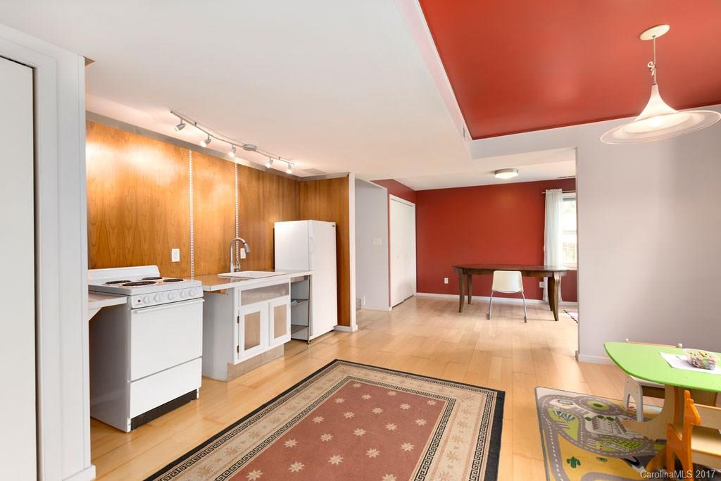 93 School Road Asheville, NC 28806 - Photo 15 of 24 a kitchen with stainless steel appliances granite countertop a sink and a refrigerator