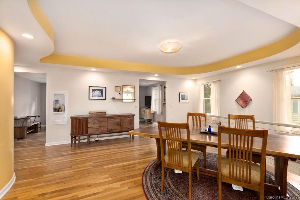 93 School Road Asheville, NC 28806 - Photo 4 of 24 a view of a dining room with furniture and wooden floor