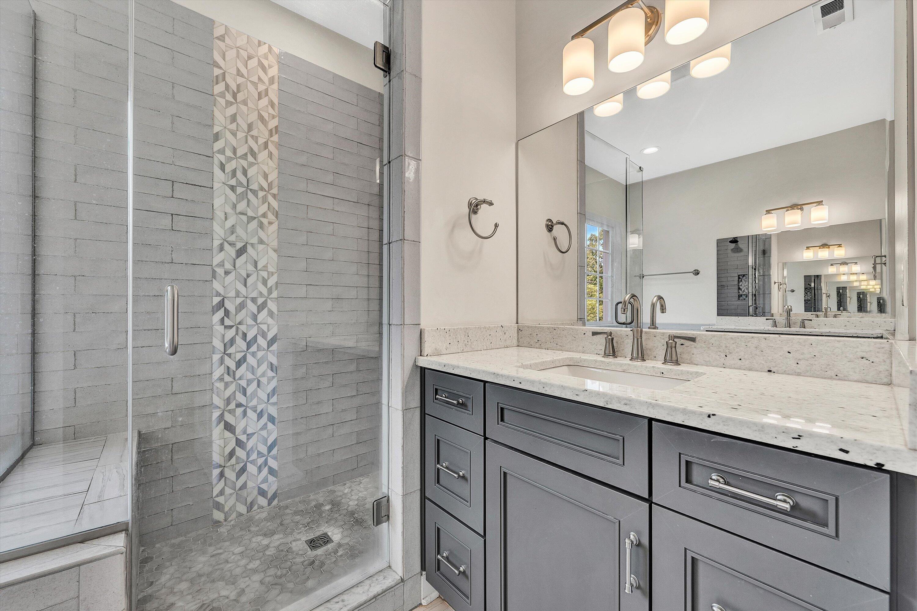 6981 Fairway Ridge Road Salem, VA 24153 - Photo 29 of 53 a bathroom with a granite countertop sink a mirror and shower