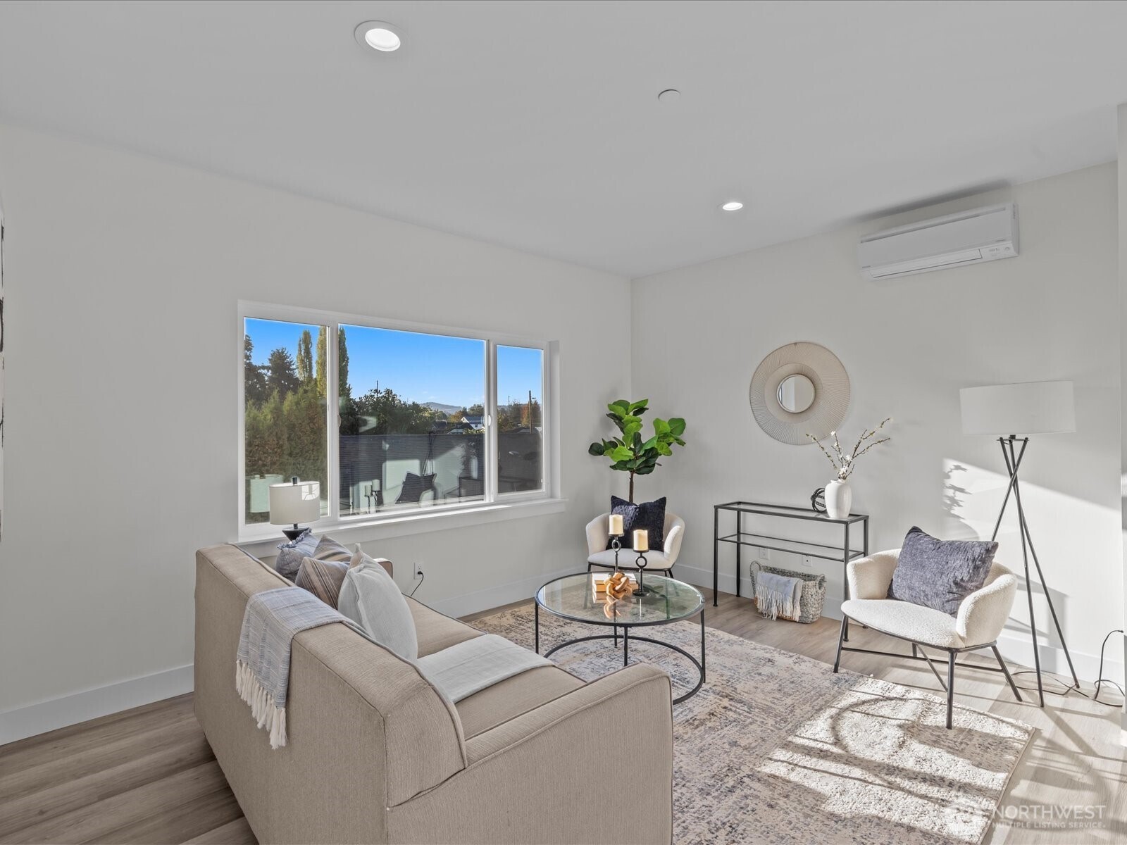 215 Corrin Avenue Northwest, Unit B Orting, WA 98360 - Photo 13 of 36 a living room with furniture and a large window