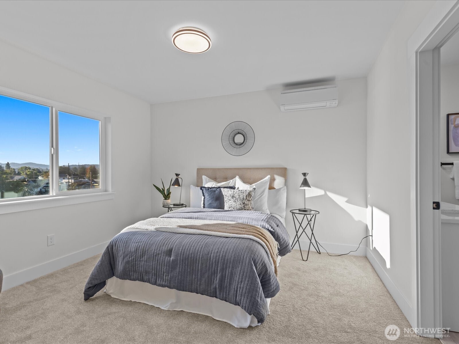 215 Corrin Avenue Northwest, Unit B Orting, WA 98360 - Photo 20 of 36 a bedroom with bed and a window