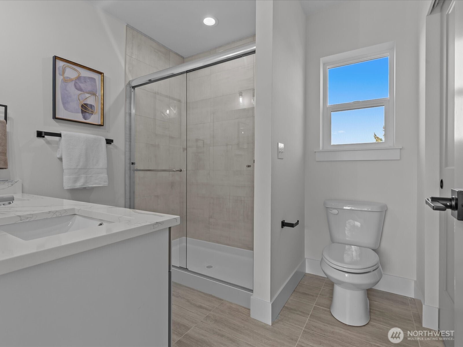 215 Corrin Avenue Northwest, Unit B Orting, WA 98360 - Photo 23 of 36 a bathroom with a toilet sink and shower