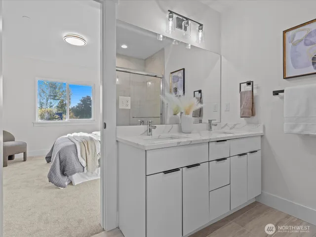 a bathroom with a sink vanity and a mirror
