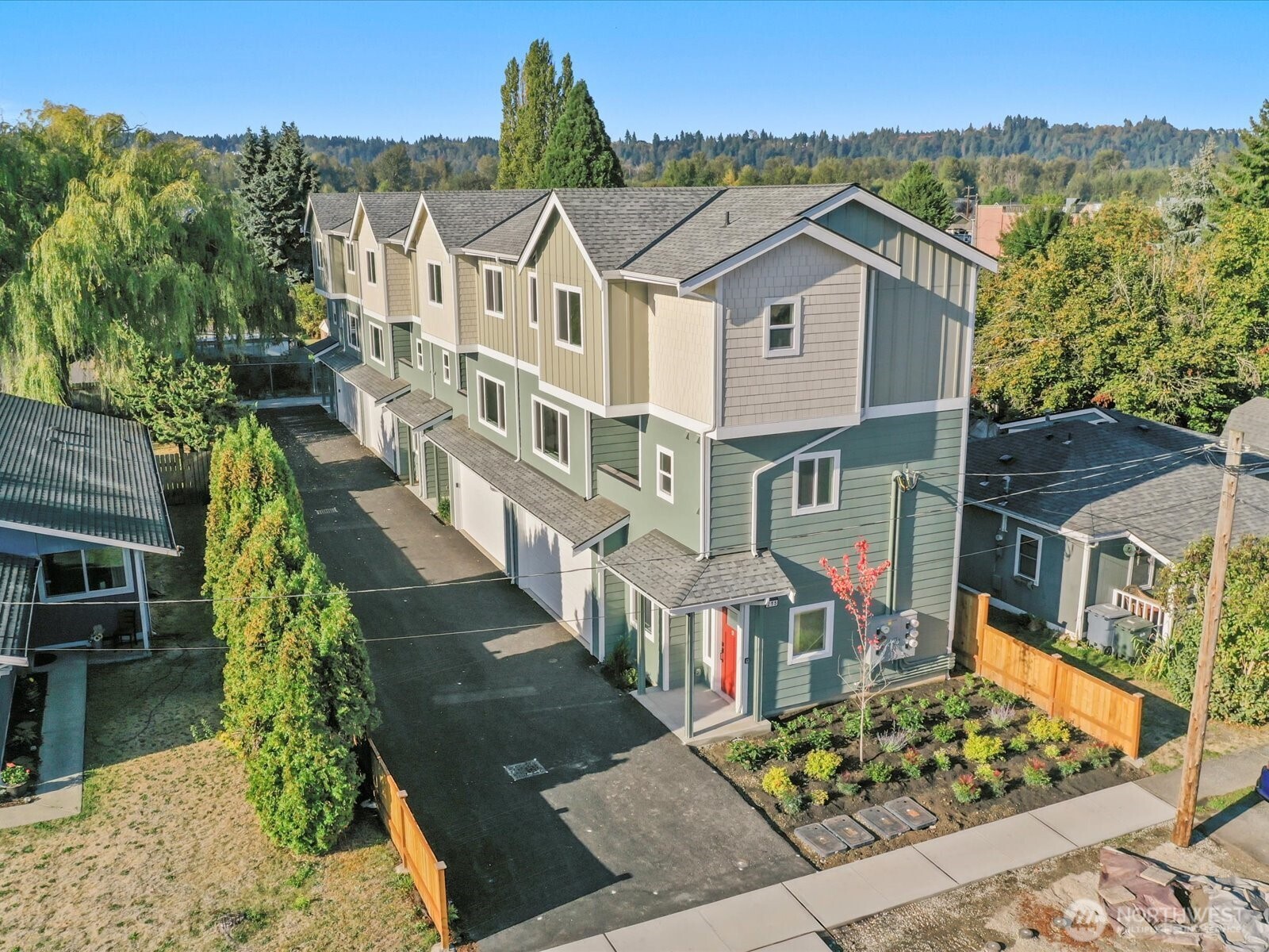 215 Corrin Avenue Northwest, Unit B Orting, WA 98360 - Photo 35 of 36 an aerial view of a residential apartment building with a yard