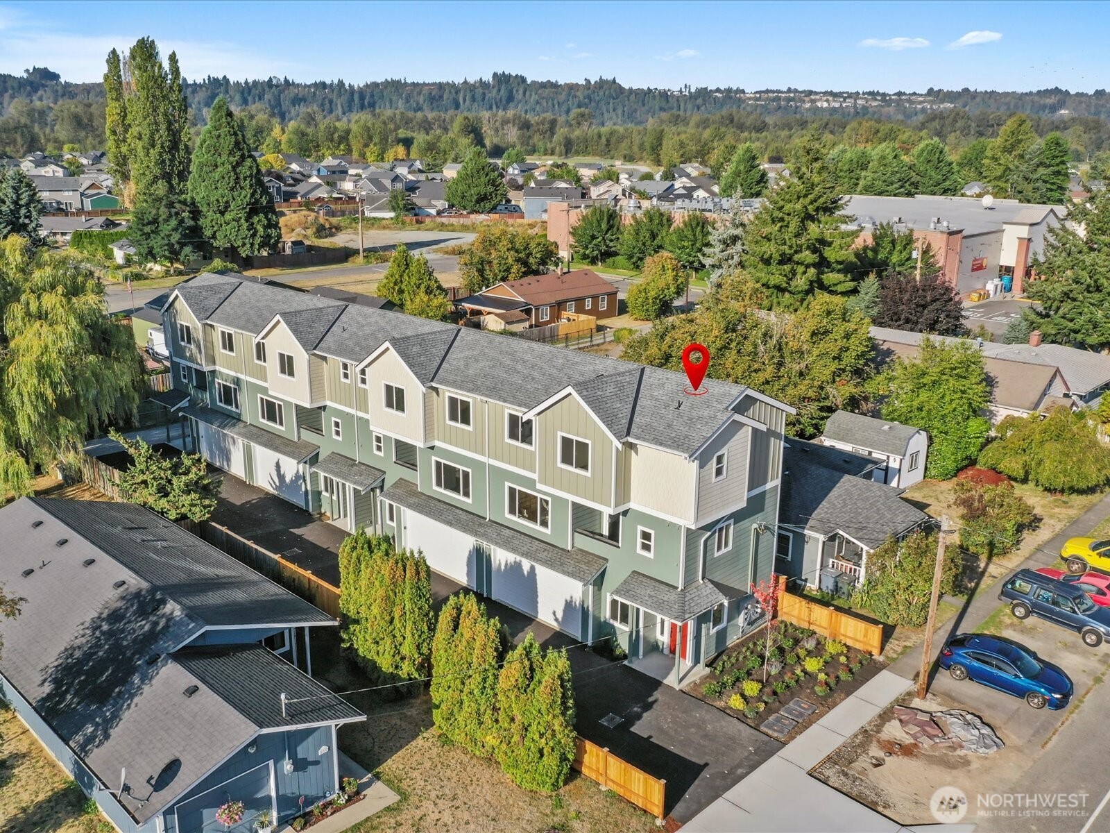 215 Corrin Avenue Northwest, Unit B Orting, WA 98360 - Photo 36 of 36 a view of a city with tall buildings