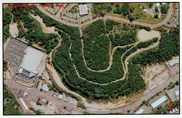 an aerial view of a residential houses with outdoor space