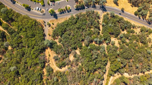 a view of a swimming pool with a yard