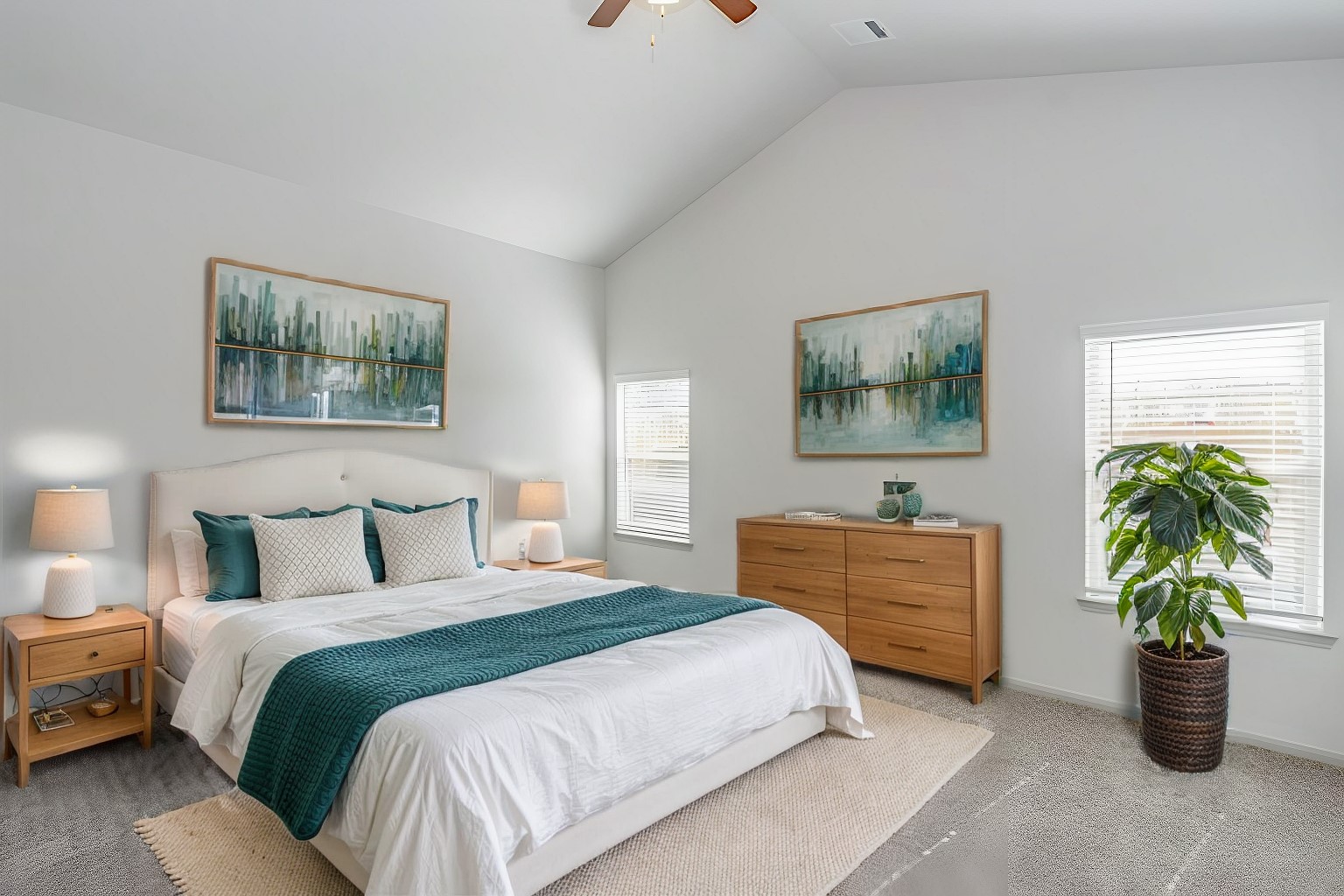 6447 Escondido Drive Rosharon, TX 77583 - Photo 8 of 16 The expansive primary bedroom is a serene sanctuary with vaulted ceilings, large windows for natural light, and soft carpeting underfoot. The open layout offers ample space for a king-sized bed and additional furnishings. A perfect retreat to relax and recharge after a busy day.