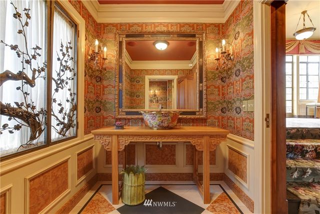 a view of a table and chairs in the patio in front of a house