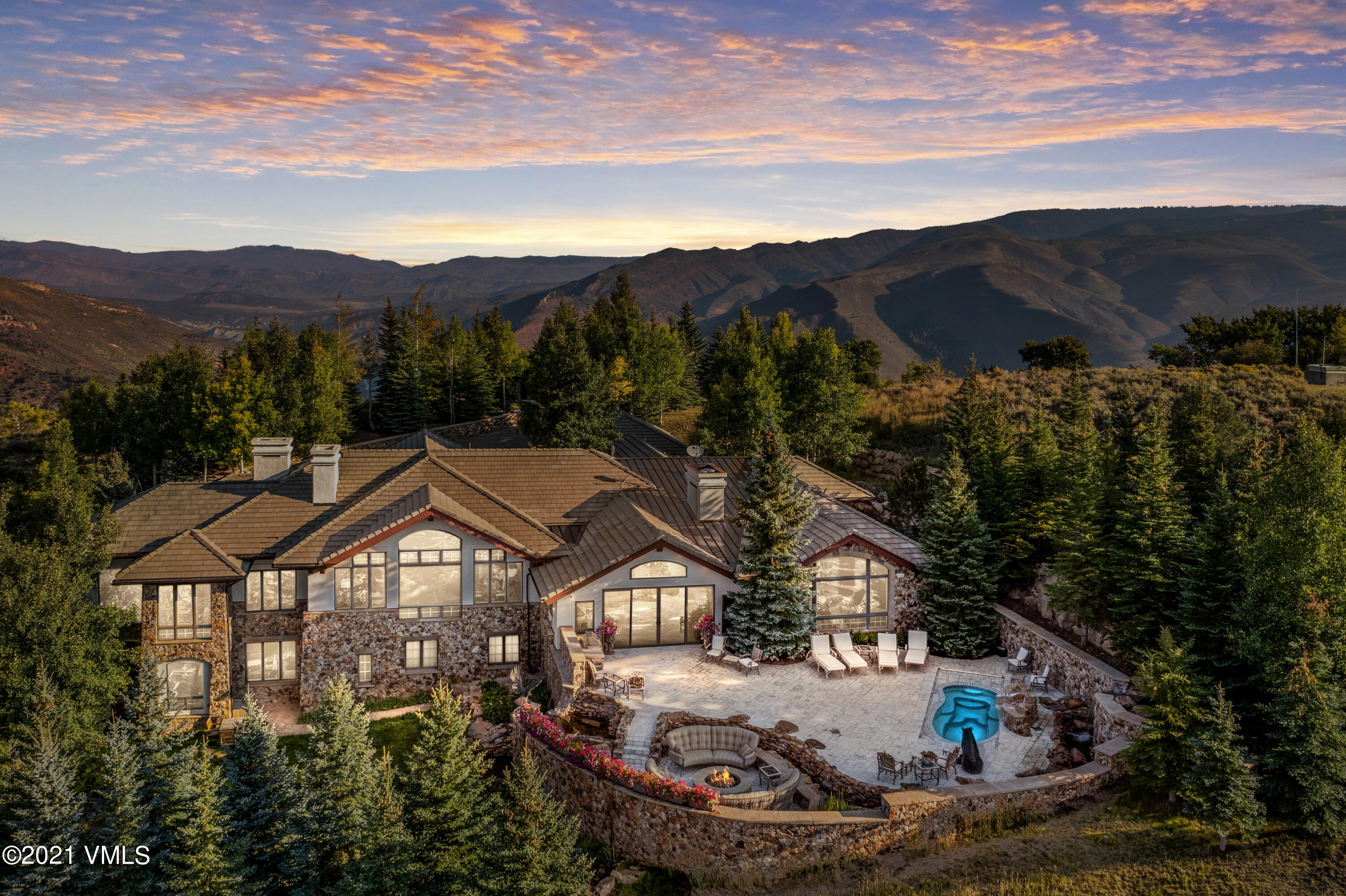 245 Casteel Ridge Edwards, CO 81632 - Photo 2 of 21 a view of a big house with a big yard and large trees