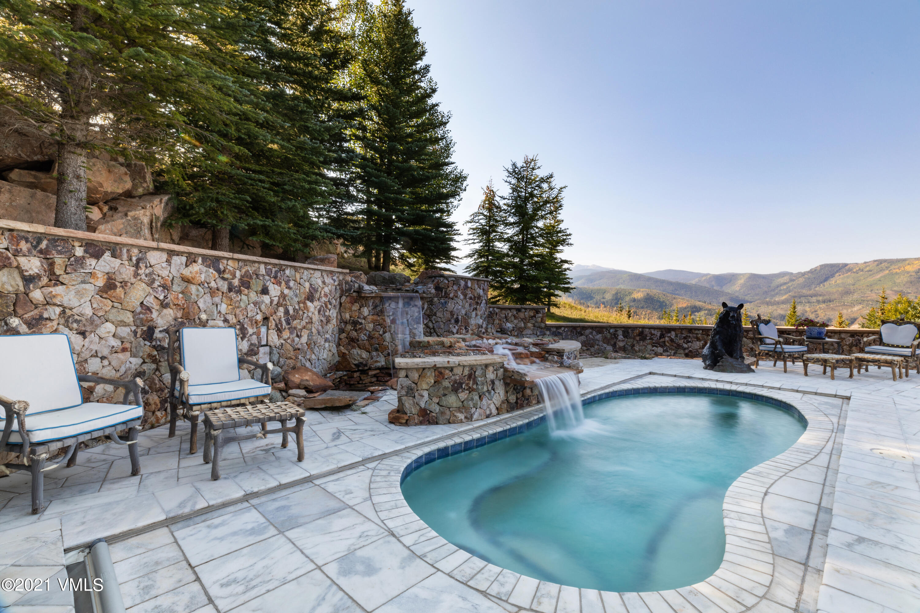 245 Casteel Ridge Edwards, CO 81632 - Photo 21 of 21 a swimming pool with outdoor seating and yard