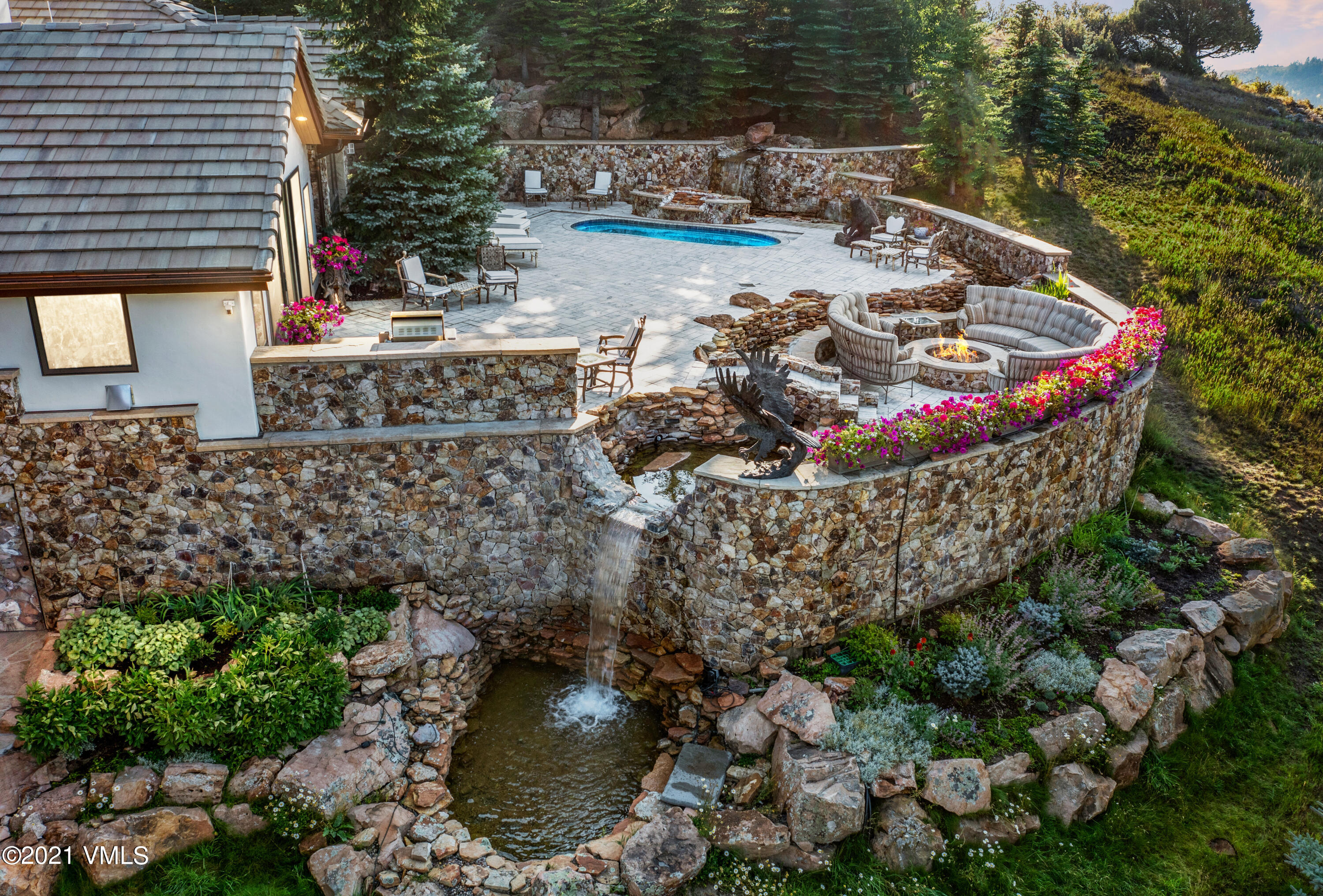 245 Casteel Ridge Edwards, CO 81632 - Photo 8 of 21 a view of a backyard with plants and lake view