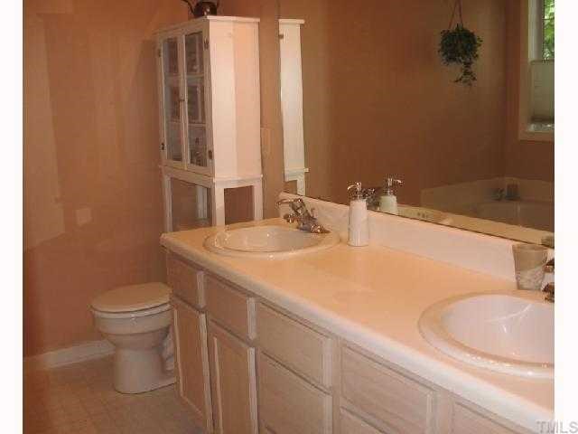 1801 Betry Place Raleigh, NC 27603 - Photo 3 of 5 Large master bath with twin vanities and garden tub.