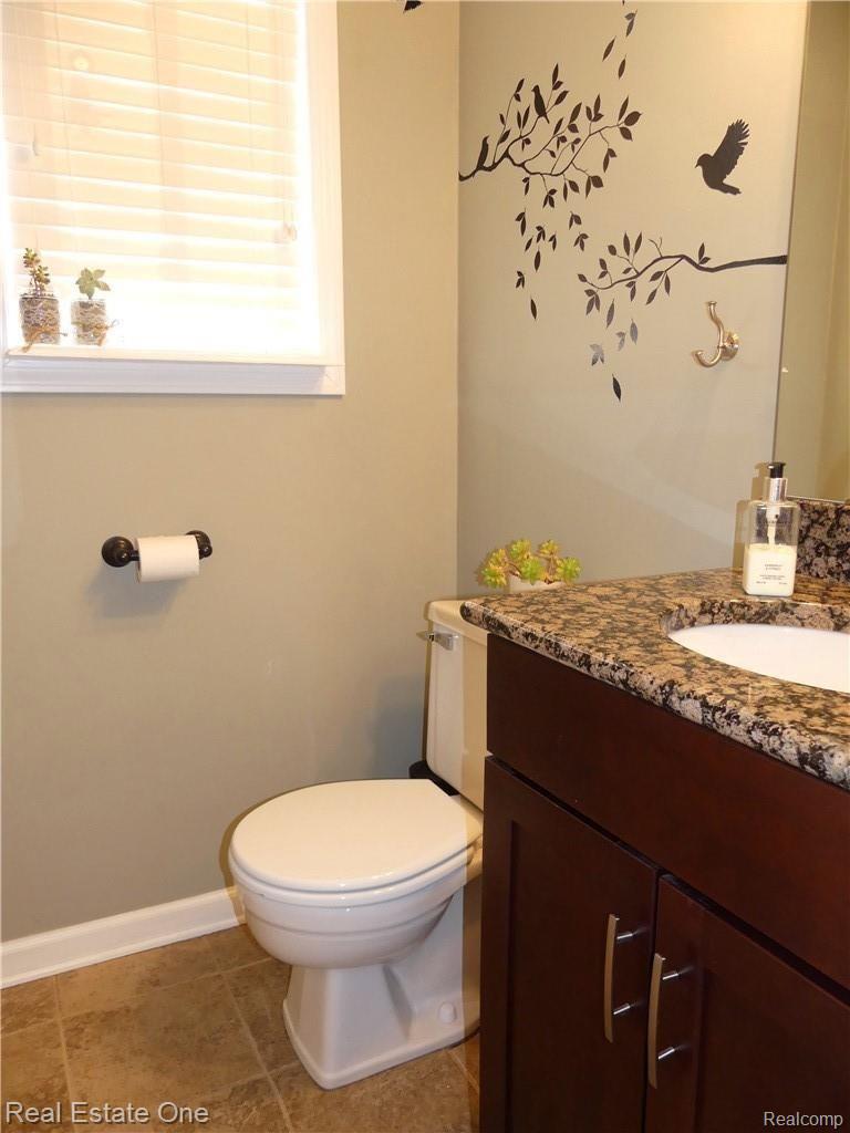 45119 Lemont Road Canton, MI 48187 - Photo 17 of 38 Updated half bath with granite counter cherry cabinet
