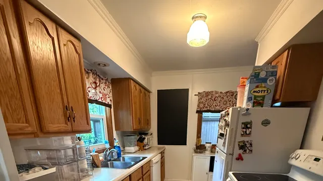 a bathroom with a sink a mirror and a toilet