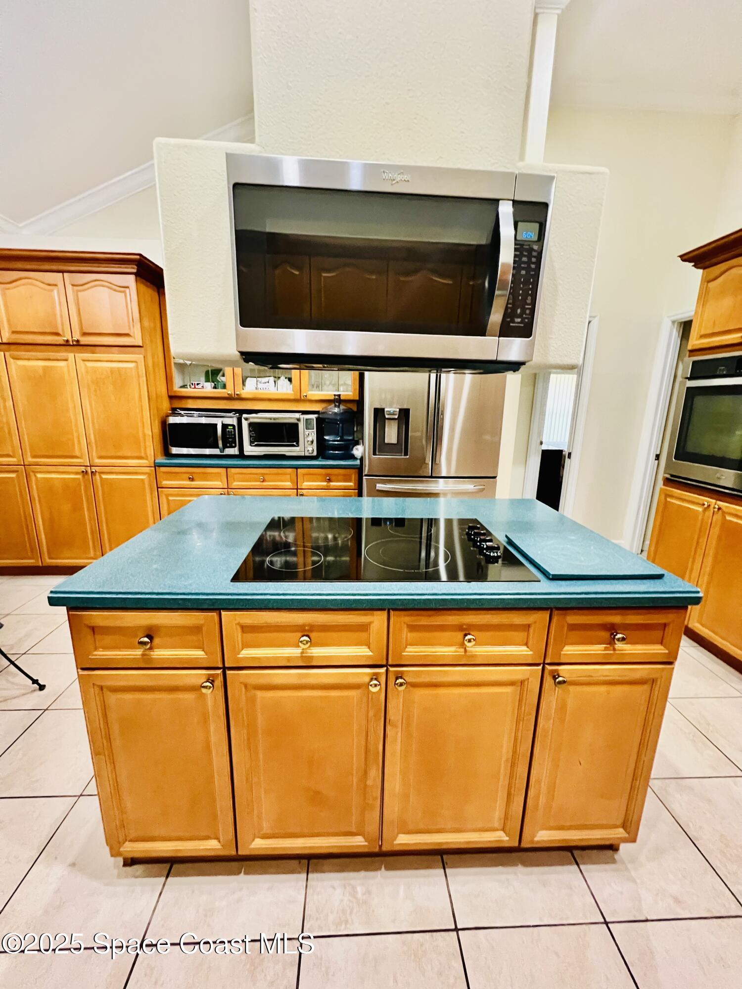 317 Lanack Road Southeast Palm Bay, FL 32909 - Photo 15 of 37 a kitchen view with wooden cabinets