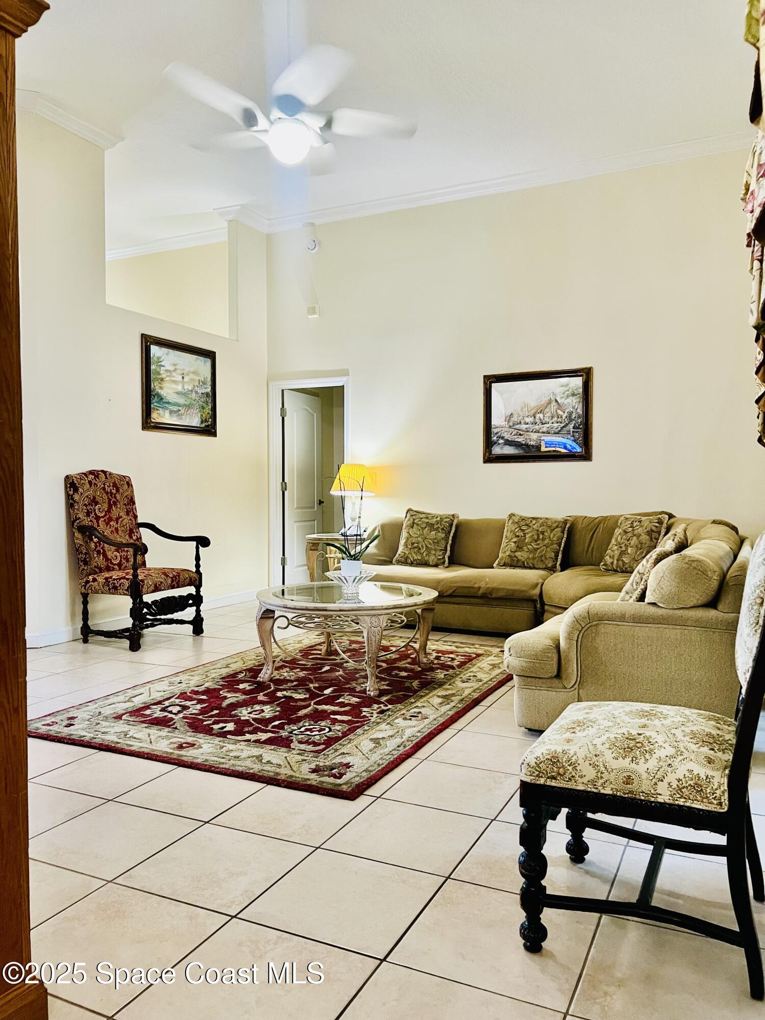 317 Lanack Road Southeast Palm Bay, FL 32909 - Photo 10 of 37 a living room with furniture rug and window