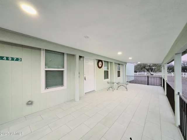 a bedroom with a bed and cabinets