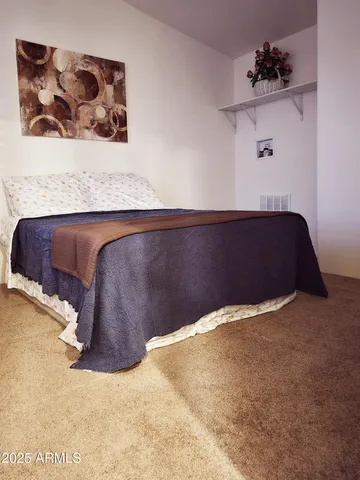 a view of a hallway with wooden floor and stairs