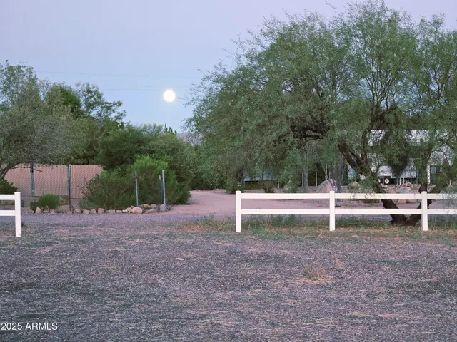 a bedroom with a bed and a table in it