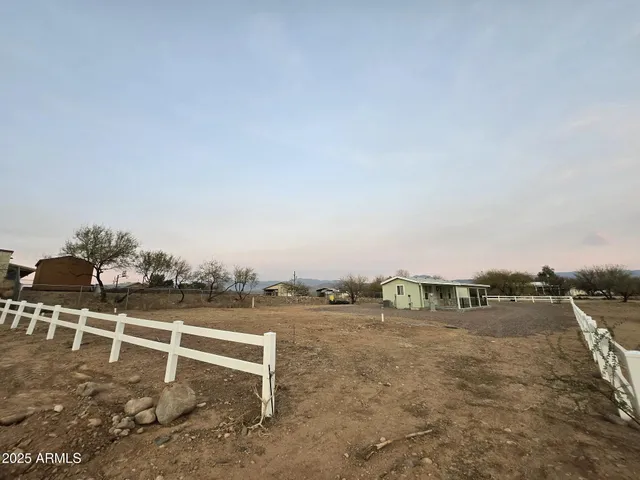 a view of a hallway with stairs