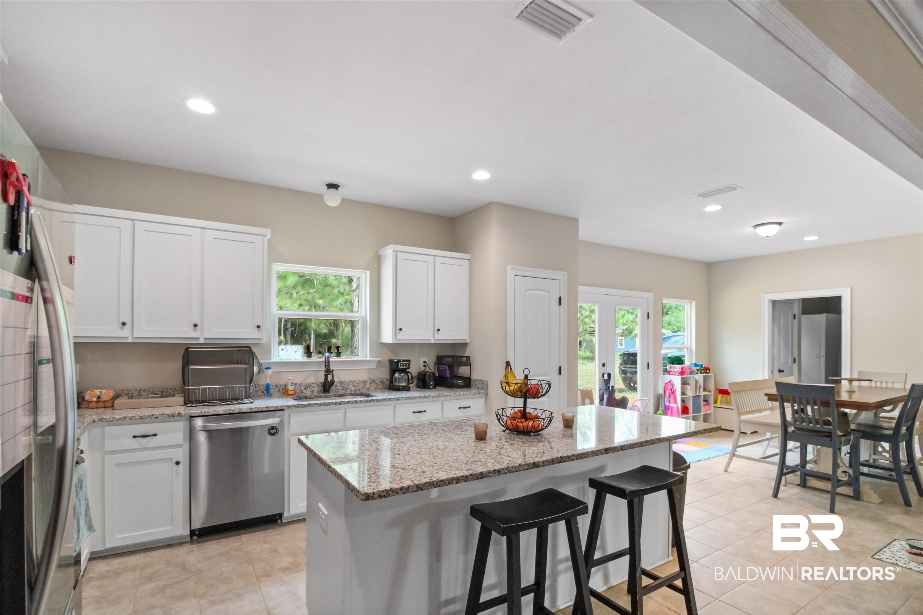 26197 Eagle Trace Elberta, AL 36530 - Photo 5 of 26 Kitchen featuring white cabinets, sink, a kitchen island, dishwasher, and light stone countertops