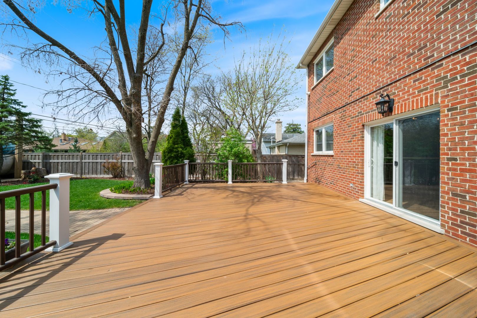701 Oakton Street Park Ridge, IL 60068 - Photo 50 of 59 a view of a backyard with wooden fence and large trees