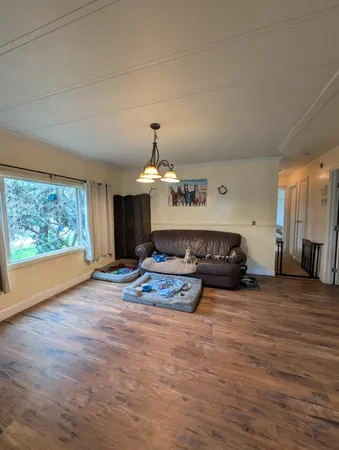 a bedroom with furniture and a chandelier