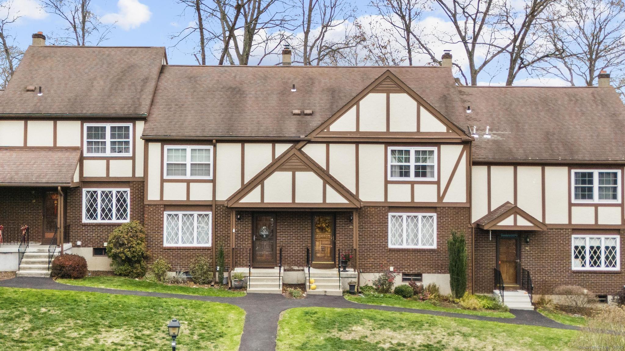 15 Derbyshire, Unit 15 Derby, CT 06418 - Photo 1 of 39 a front view of house and yard with green space