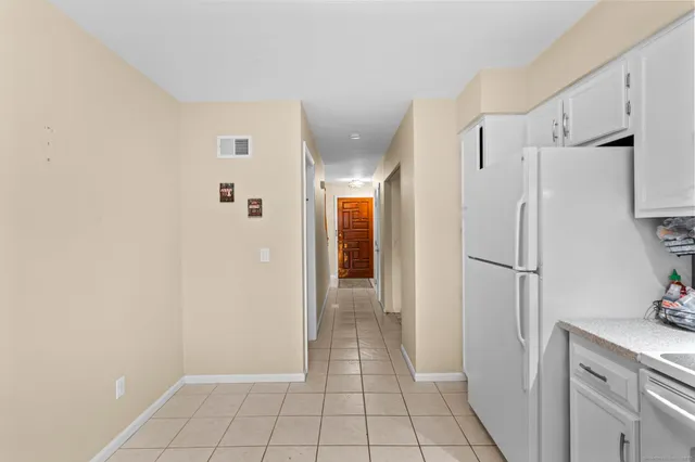 a bathroom with a light fixture and a mirror
