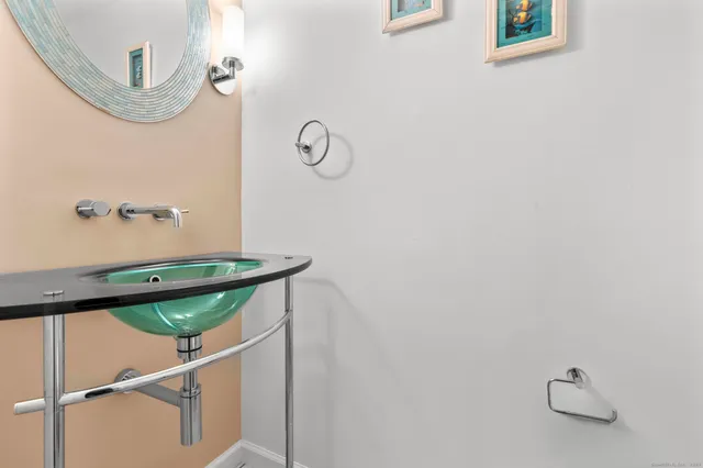 a bedroom with a bed and a potted plant