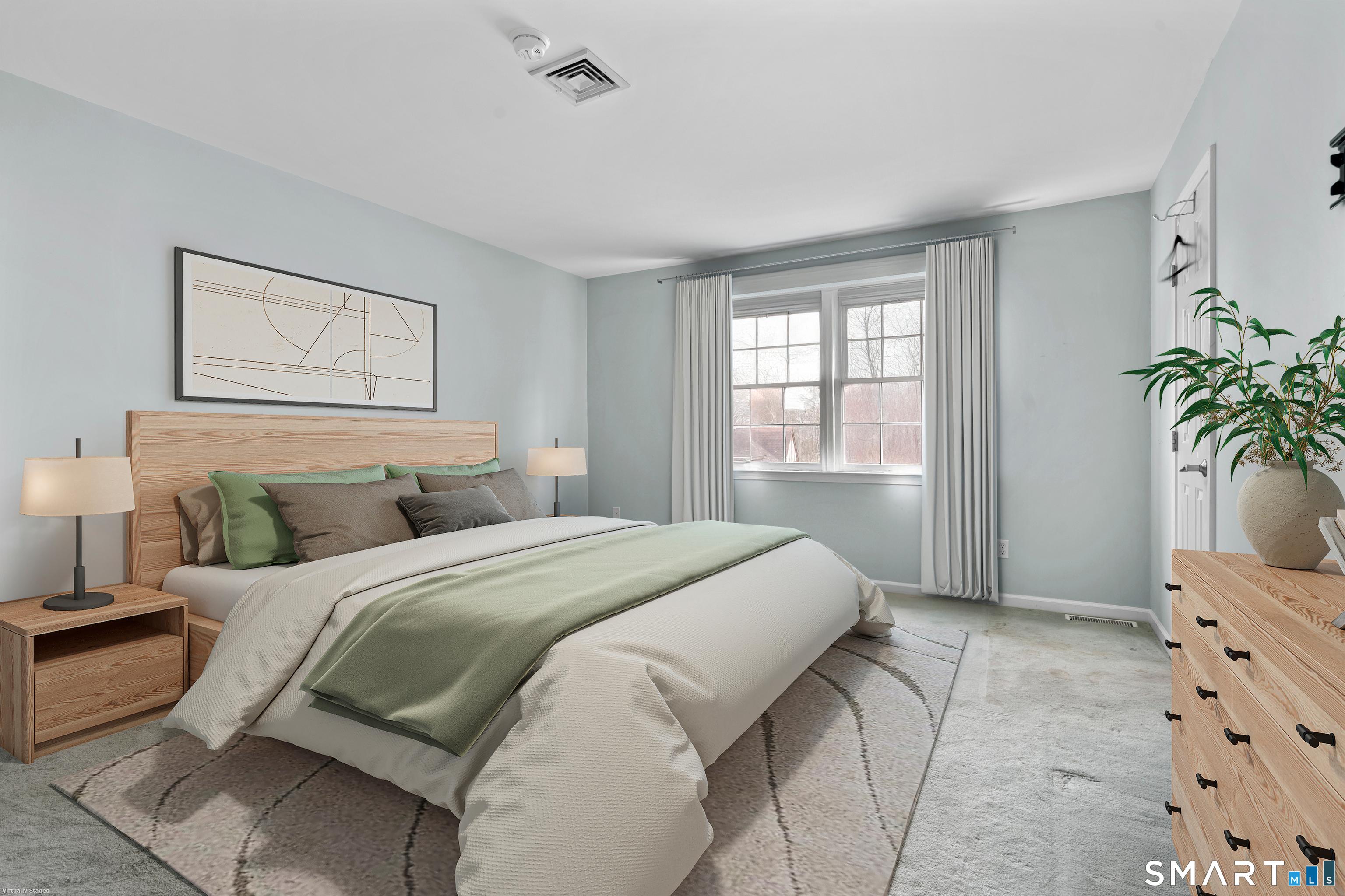 15 Derbyshire, Unit 15 Derby, CT 06418 - Photo 13 of 39 a bedroom with a bed and a potted plant