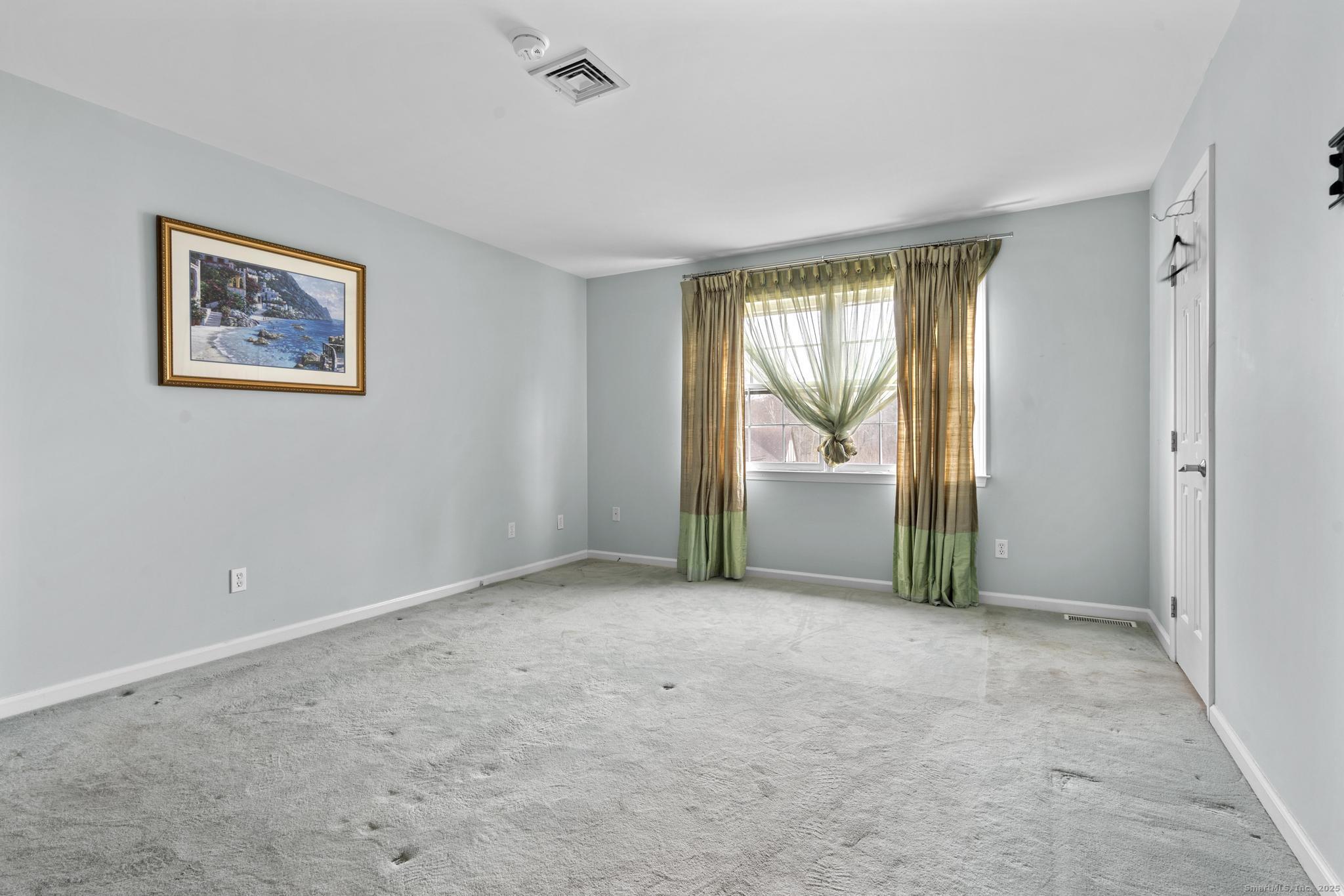 15 Derbyshire, Unit 15 Derby, CT 06418 - Photo 14 of 39 a view of an empty room with a window